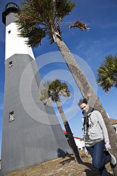 Girl posing by Tybee Island Lighthouse