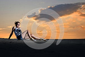 Girl posing under twilight sky