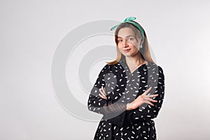 Girl power concept. Confident young woman isolated on gray wall background. Feminine and independent strength.Copy space