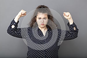 Girl power concept for unhappy overweight young brunette