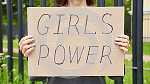 Girl Power concept. Unrecognizable person holds sign with text about feminism