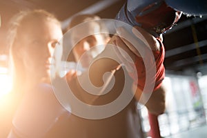 Girl practicing boxing with coach