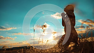 Girl praying. girl folded her hands lifestyle in prayer silhouette at sunset. slow motion video. Girl folded her hands