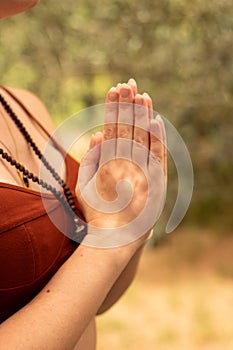 a girl prays to her with a rudraksha necklace energy stones photo