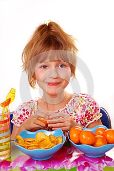 Girl preferring fruits than chips photo