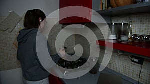 A girl prepare coffee espresso with italian moka in the kitchen, morning coffee