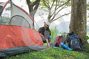 Girl prepare tent nature tourism concept