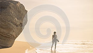 A girl is preparing to practice outdoor yoga on the ocean. Calmness and relax. Background with ocean view and yoga