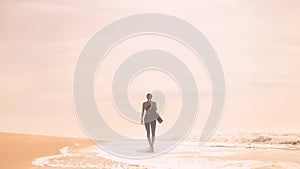 A girl is preparing to practice outdoor yoga on the ocean. Calmness and relax. Background with ocean view and yoga