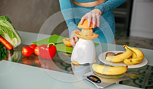 Girl preparing a vegetarian breakfast and fresh orange juice