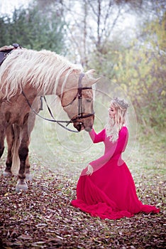 Girl, princess sitting with horse, fantasy. Fairy tale