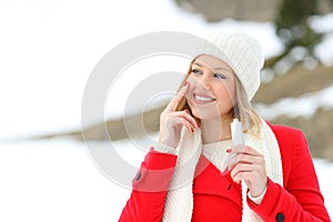 Girl protecting skin applying moisturizer cream