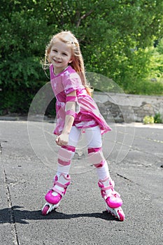 Girl in protection rollerskating