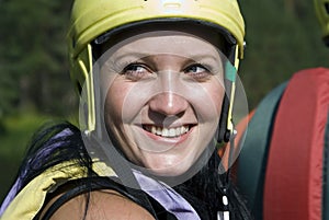 Girl in a protective helmet and a life jacket