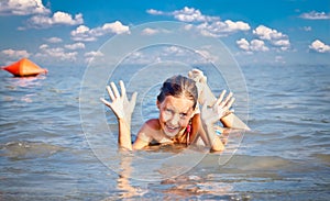 Girl on the public beach Strand at Danube river in Novi Sad.