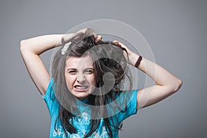 Girl pulling her hair