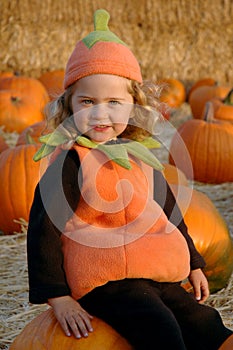 Girl in pumpkin patch