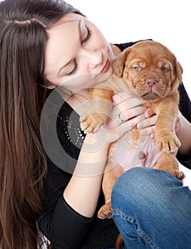 Girl with puppy of Dogue de Bordeaux