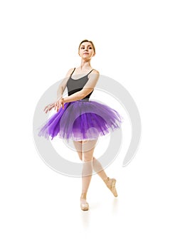 Girl in purple tutu and black leotard dance ballet