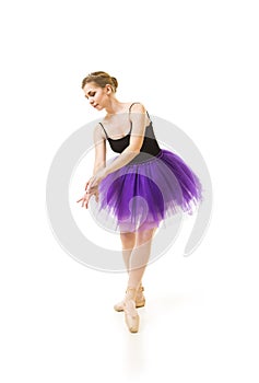 Girl in purple tutu and black leotard dance ballet