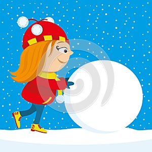 Girl pushes a big snowball. photo