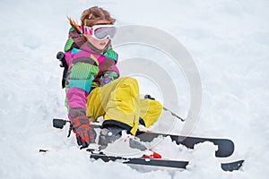 Girl putting on skis