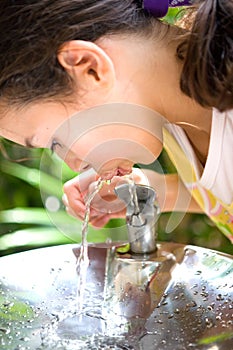 Girl quenching thirst photo