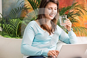 Girl quenching thirst with water