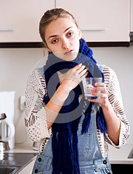 Girl with quinsy taking medicine photo