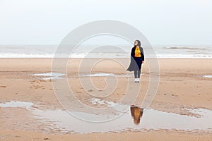 Girl rain sea wind winter portrait woman smile spring coat long hair curly mood shore snow beach