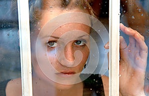 Girl in rainy window