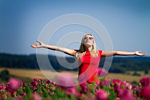 Girl with raised arms outdoors