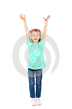 Girl raises her arms up and smiles