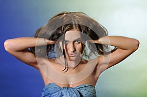 Girl raises her hands in the hair studio