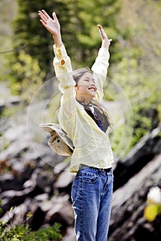 Girl raising hands in praise