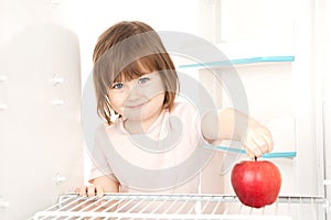 Girl reaching for apple