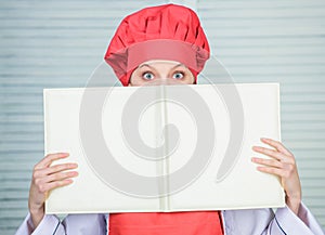 Girl read big book of seating plan, copy space. cook in restaurant. professional chef cooking in kitchen. secret. menu