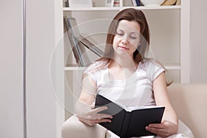 Girl read book at home