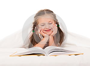 Girl read book in white bed