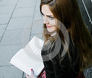 Girl reading book / student reading a book/ in park /