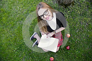 Girl reading book / student reading a book/ in park /