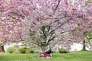 Girl reading book / student reading a book/ in park /