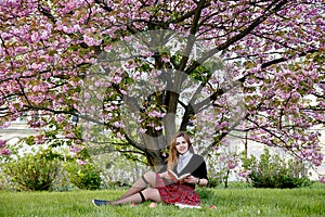 Girl reading book / student reading a book/ in park /