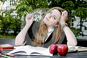 Girl reading book / student reading a book/ in park /