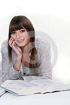 Girl reading an encyclopedia