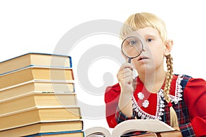 Girl reading with loupe