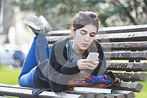 Girl reading message on phone, adolescence lifestile concept, ou