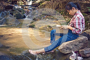 Girl reading in the midst.