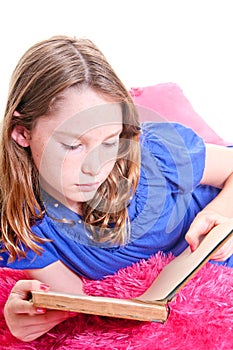 Girl reading on pillows