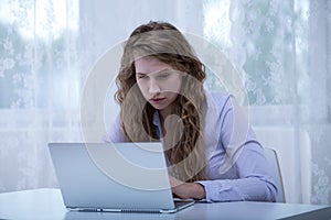 Girl reading rumor on internet